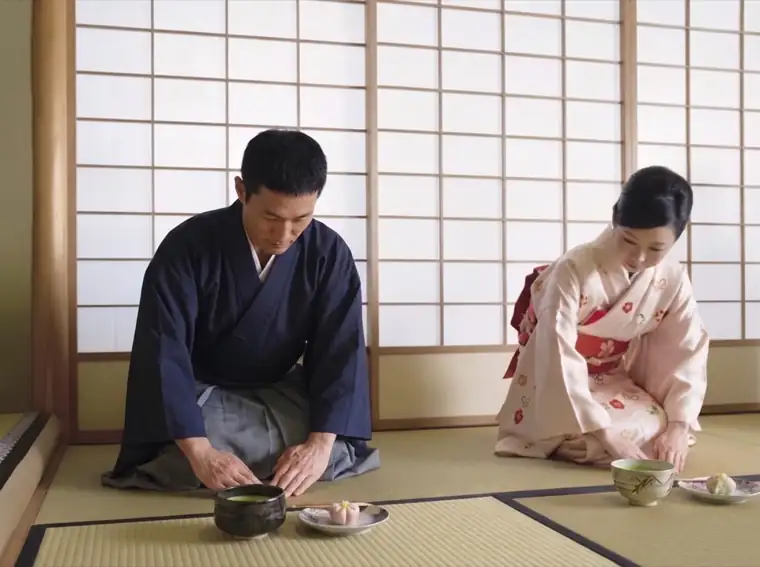 Host and guest bowing over matcha in a tatami tea room in Nagoya, the Bushido spirit of rei (respect)