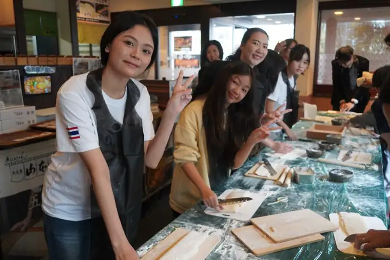 Guests making miso nikomi udon by hand in Nagoya